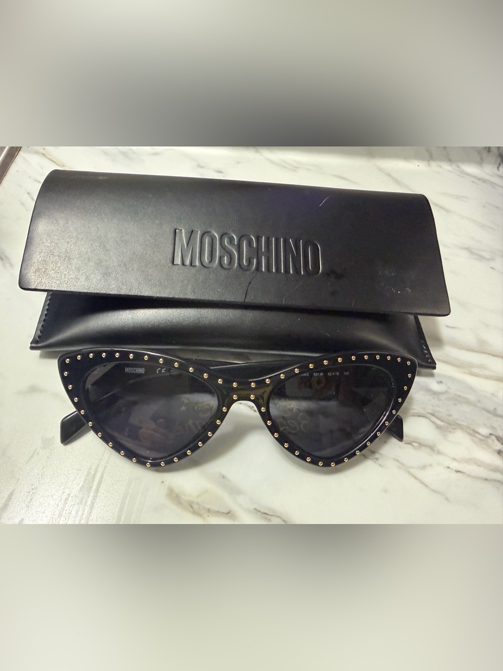 Moschino Black Cat-Eye Sunglasses with Gold Stud Accents